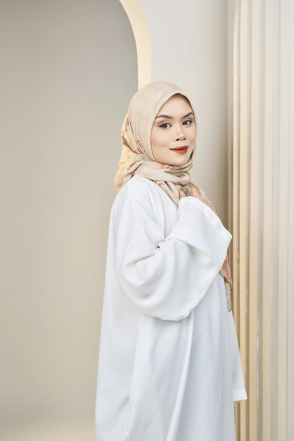 Sandy Brown tudung bawal side profile neutral background — Hana
